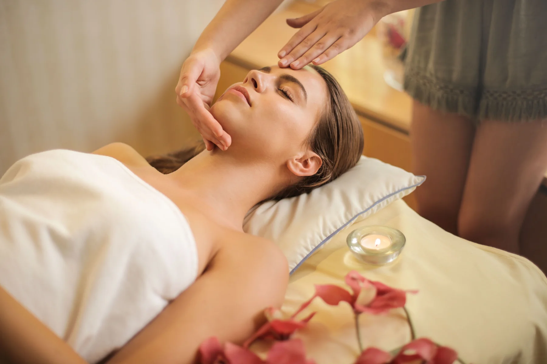 Relaxing face and head massage in a calm spa setting